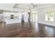 Spacious living room with hardwood floors, high ceilings, and lots of natural light at 9416 Bullfrog Court, Gibsonton, FL 33534