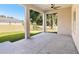Covered patio with ceiling fan, perfect for outdoor relaxation and entertaining at 9416 Bullfrog Court, Gibsonton, FL 33534