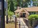Charming Lake Tarpon Lodge building with stone accents, complemented by lush landscaping at 946 Madrid Dr, Palm Harbor, FL 34684