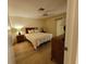 Cozy main bedroom featuring hardwood floors, natural light, and neutral decor at 946 Madrid Dr, Palm Harbor, FL 34684