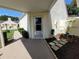 Cozy covered patio with a lush garden, offering a relaxing outdoor space at 946 Madrid Dr, Palm Harbor, FL 34684
