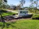 Welcoming community sign for Highland Lakes Club, set in a lush, green landscape at 946 Madrid Dr, Palm Harbor, FL 34684