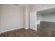 Cozy room with hardwood floors, neutral paint, and an doorway leading to living space at 9955 Surrey Rose Dr, San Antonio, FL 33576