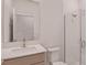 Modern bathroom showcasing a stylish vanity, toilet, and glass-enclosed shower at 9989 Surrey Rose Dr, San Antonio, FL 33576