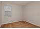 Well-lit carpeted bedroom with a window and neutral paint, offering a cozy and inviting space at 9989 Surrey Rose Dr, San Antonio, FL 33576