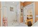 Bathroom showcasing a walk-in shower with a seat and a safety bar for accessibility at 1001 E Crawford St, Tampa, FL 33604