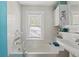 Bathroom featuring a tub, shower combo, and a pedestal sink at 1001 E Crawford St, Tampa, FL 33604