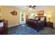 Comfortable bedroom with a ceiling fan, a large bed, and ample natural light from the windows at 1001 E Crawford St, Tampa, FL 33604