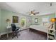 Light-filled bedroom featuring a ceiling fan and carpeted floor at 1001 E Crawford St, Tampa, FL 33604