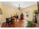 Cozy dining room with hardwood floors and decorative light fixture, perfect for Gathering meals at 1001 E Crawford St, Tampa, FL 33604