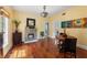 Elegant dining room featuring hardwood floors, decorative lighting, and ample seating space at 1001 E Crawford St, Tampa, FL 33604