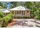Beautiful house with a well-kept front yard, complemented by lush greenery and a neat brick driveway at 1001 E Crawford St, Tampa, FL 33604