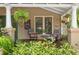 Cozy front porch featuring chairs, plants, and decorative elements for a relaxing feel at 1001 E Crawford St, Tampa, FL 33604