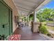 Inviting front porch with ample seating, perfect for enjoying the neighborhood views at 1001 E Crawford St, Tampa, FL 33604