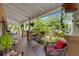 Relaxing front porch featuring comfortable seating and a serene outdoor ambiance at 1001 E Crawford St, Tampa, FL 33604