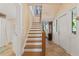 Hallway with tile floors leads to staircase at 1001 E Crawford St, Tampa, FL 33604