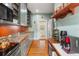 This kitchen features modern stainless steel appliances, custom cabinets, and hardwood floors at 1001 E Crawford St, Tampa, FL 33604
