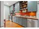 Charming kitchen features custom wood cabinets, stainless steel appliances, and hardwood floors at 1001 E Crawford St, Tampa, FL 33604