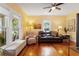 Bright living room with hardwood floors, large windows, and comfortable seating area at 1001 E Crawford St, Tampa, FL 33604