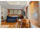 Multi-functional living space with a dining area, bed, and natural light at 1001 E Crawford St, Tampa, FL 33604
