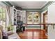 Well-lit home office boasts built-in bookshelves and hardwood floors at 1001 E Crawford St, Tampa, FL 33604