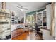 Bright office with beautiful hardwood floors, lots of shelving, and large windows at 1001 E Crawford St, Tampa, FL 33604