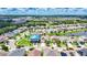 Aerial view of the neighborhood featuring a well-maintained lawn and mature landscaping at 10626 Park Meadowbrooke Dr, Riverview, FL 33578