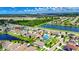 Aerial view of the property with pond, mature trees and foliage in a suburban neighborhood at 10626 Park Meadowbrooke Dr, Riverview, FL 33578