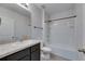 Bright bathroom featuring a vanity with countertop space and a shower-tub combo at 10626 Park Meadowbrooke Dr, Riverview, FL 33578
