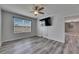 A bedroom with a TV, ceiling fan, and a window at 10626 Park Meadowbrooke Dr, Riverview, FL 33578