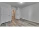 Bedroom features stylish wood-look flooring and two doors at 10626 Park Meadowbrooke Dr, Riverview, FL 33578