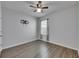 Bedroom featuring wood-look floors, a ceiling fan and a bright window at 10626 Park Meadowbrooke Dr, Riverview, FL 33578