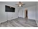 A bedroom with a TV on the wall and multiple doorways at 10626 Park Meadowbrooke Dr, Riverview, FL 33578