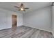 Bedroom with a ceiling fan and an adjacent bathroom at 10626 Park Meadowbrooke Dr, Riverview, FL 33578