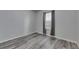 Bedroom with gray walls and gray wood-look flooring at 10626 Park Meadowbrooke Dr, Riverview, FL 33578