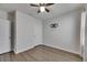 Bright bedroom features stylish ceiling fan and modern wood-look flooring at 10626 Park Meadowbrooke Dr, Riverview, FL 33578