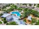 Aerial view featuring the community pool, playground, palm trees, and a clubhouse at 10626 Park Meadowbrooke Dr, Riverview, FL 33578