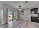 Cozy dining area with slider doors, custom lighting, and access to outdoor patio at 10626 Park Meadowbrooke Dr, Riverview, FL 33578
