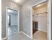 Hallway leading to laundry room with open doorway and gray paint at 10626 Park Meadowbrooke Dr, Riverview, FL 33578