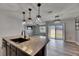 Open kitchen overlooks a living area and backyard at 10626 Park Meadowbrooke Dr, Riverview, FL 33578