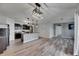 Modern kitchen with dark cabinets, granite countertops, a center island, and stainless steel appliances at 10626 Park Meadowbrooke Dr, Riverview, FL 33578