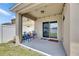 Covered patio with string lights, sliding glass door, and a charming blue outdoor seating set at 10626 Park Meadowbrooke Dr, Riverview, FL 33578