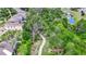 Scenic view of a winding walking path through a wooded area, connecting homes to a serene natural setting at 10626 Park Meadowbrooke Dr, Riverview, FL 33578