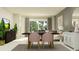 Inviting dining area features an elegant table, stylish chairs, and abundant natural light at 10869 Rustic Eve Ct, Land O Lakes, FL 34638