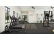 Bright gym features modern equipment, treadmills, and an open layout for fitness enthusiasts at 10869 Rustic Eve Ct, Land O Lakes, FL 34638