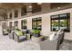 Outdoor lounge area features comfortable patio furniture and an outdoor ceiling fan at 10869 Rustic Eve Ct, Land O Lakes, FL 34638