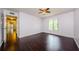 Spacious bedroom featuring hardwood floors and a bright window at 1170 Pine Ridge W Cir # C2, Tarpon Springs, FL 34688