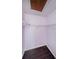 Walk-in closet with wood floor and wire shelving at 1170 Pine Ridge W Cir # C2, Tarpon Springs, FL 34688