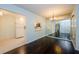Cozy dining area featuring a mirrored wall, elegant lighting, and an open view into the kitchen at 1170 Pine Ridge W Cir # C2, Tarpon Springs, FL 34688