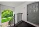 Exterior entrance to unit with stairs and a secure door at 1170 Pine Ridge W Cir # C2, Tarpon Springs, FL 34688